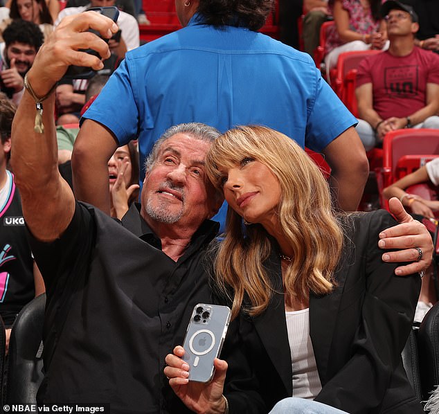 Sylvester Stallone, 77, and wife Jennifer Flavin, 55, look to have put all  their past marital woes behind them as they cuddle up at a Miami Heat game  | Daily Mail Online