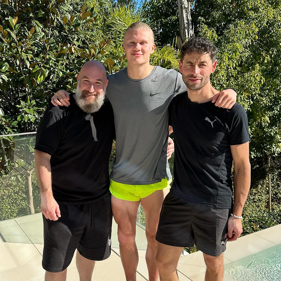 Biomechanics expert John Haddad, left, with Erling Haaland, centre