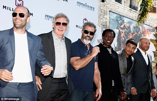 The boys are back: Statham, Ford, Gibson, Snipes, Ortiz, and Randy Couture - pictured from left to right - are among those who also appeared at a photocall for the film