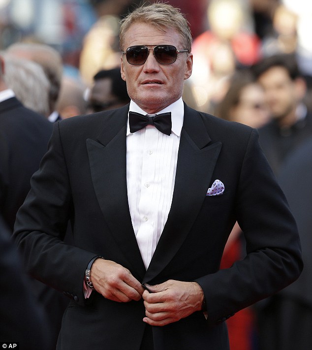 Scrubbing up: Dolph Lundgren, 56, looked youthful in a smart black suit and sunglasses at the event