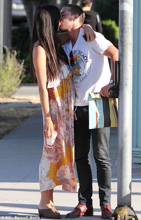 Kiss me quick: Shia LaBeouf gives his girlfriend Karolyn Pho a passionate kiss in Studio City