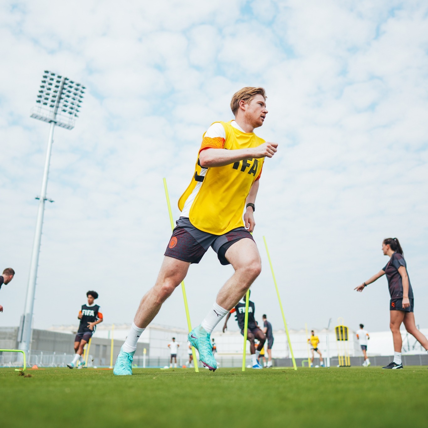 Could be an image of 6 people, athletics, people playing soccer, people playing soccer, and text that says 'FIFA'