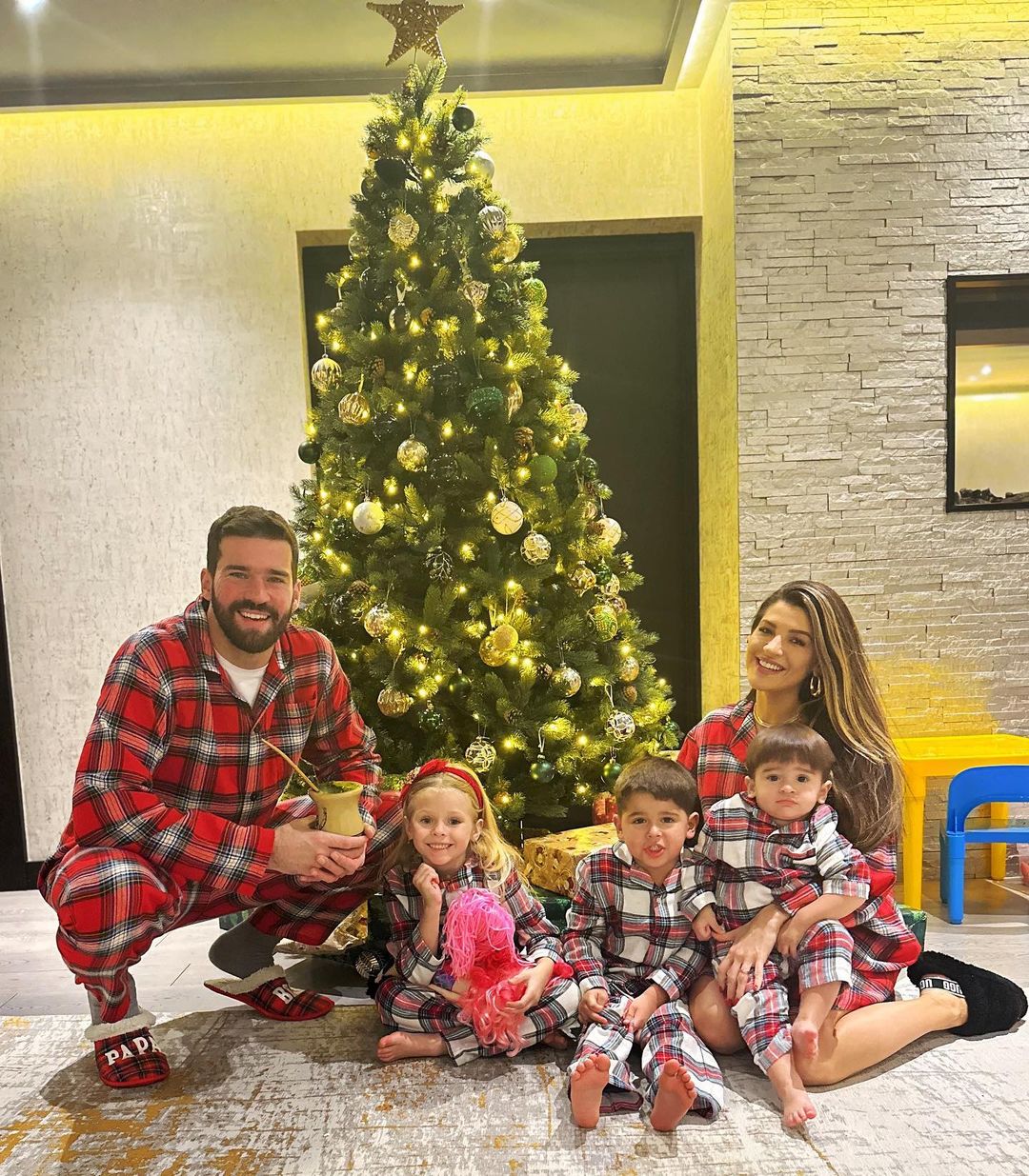 Liverpool keeper Alisson donned matching pyjamas with his wife while the kids also co-ordinated