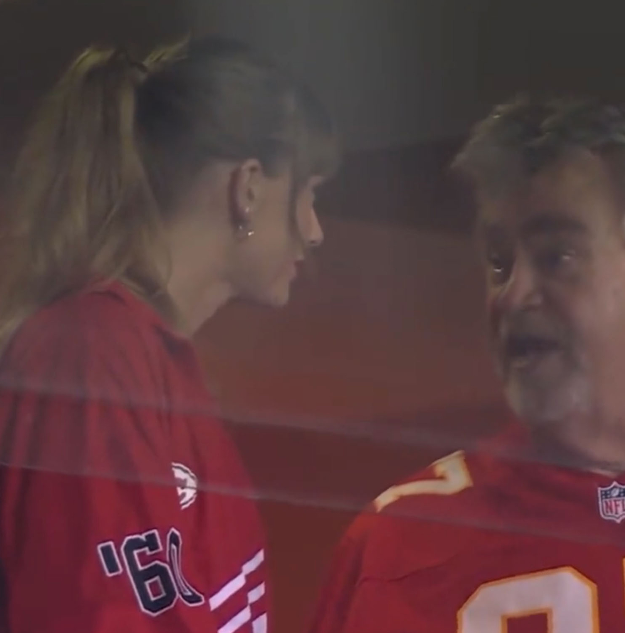 Taylor Swift chatting with Ed kelce.