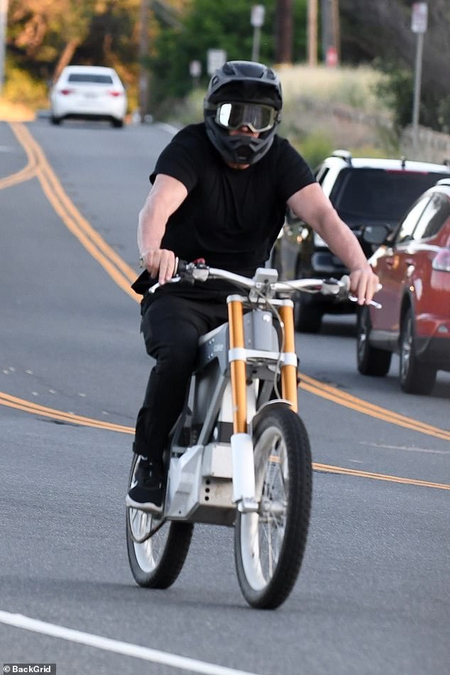 On his way: Jason was properly kitted out for his outing wearing goggles and a safety helmet