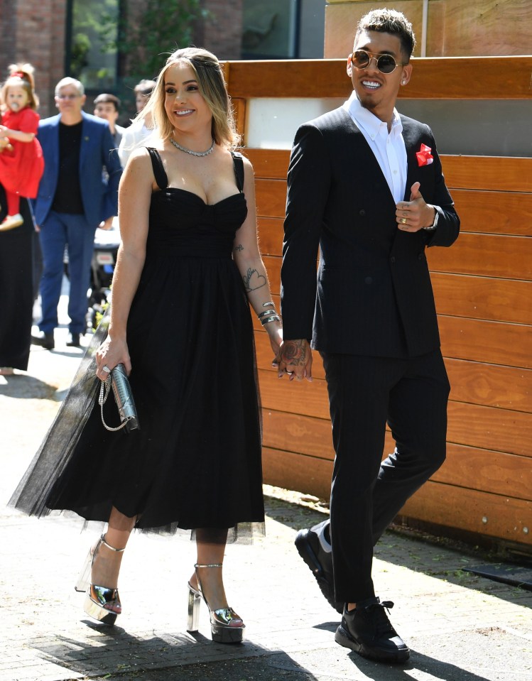 Roberto Firmino walked towards the bus with wife Larissa