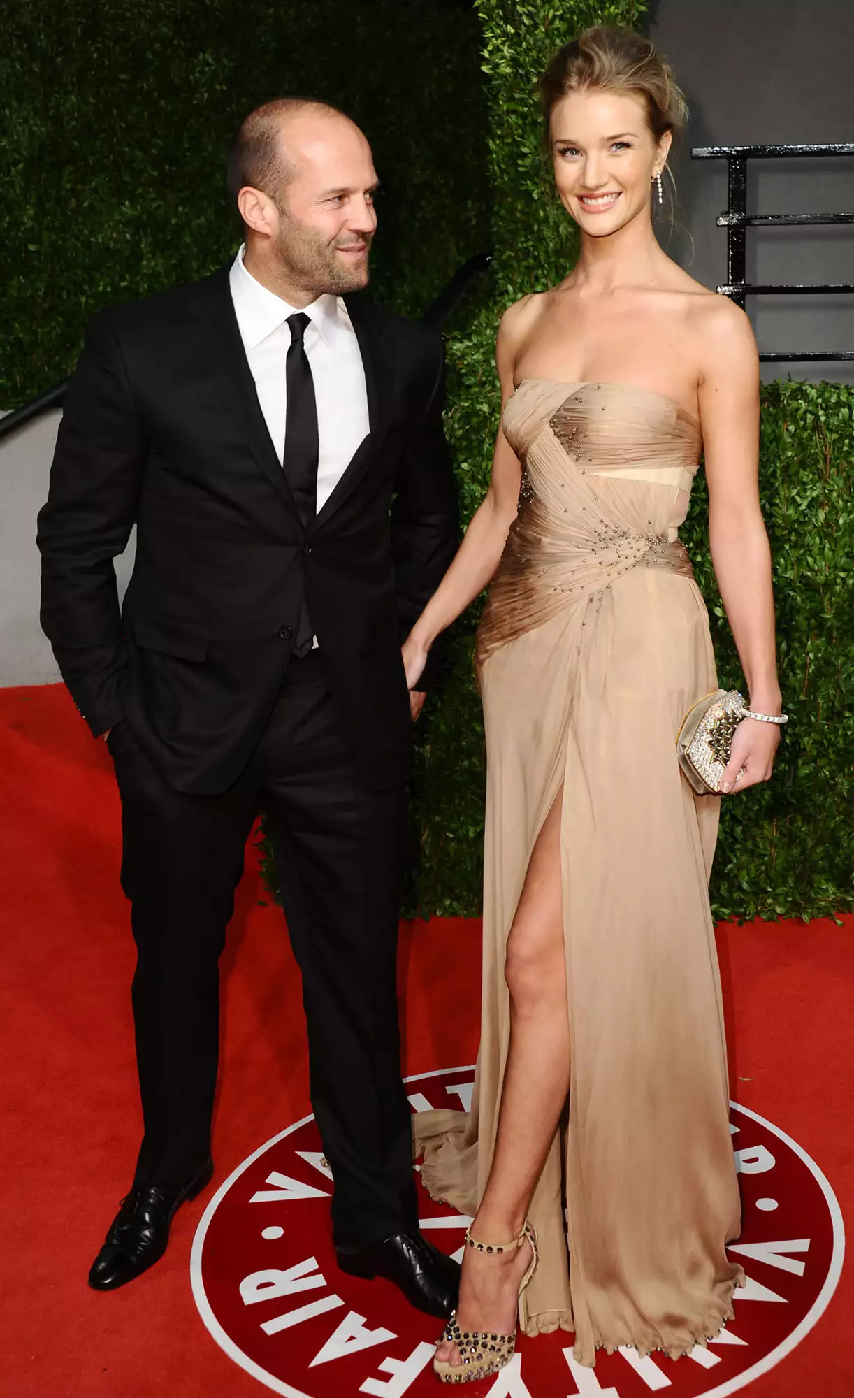 Jason Statham and model / actress Rosie Huntington-Whiteley arrive at the Vanity Fair Oscar party hosted by Graydon Carter held at Sunset Tower on February 27, 2011 in West Hollywood, California