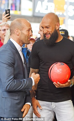 Howard and Statham speak in front of crowds outside the TV studio in New York