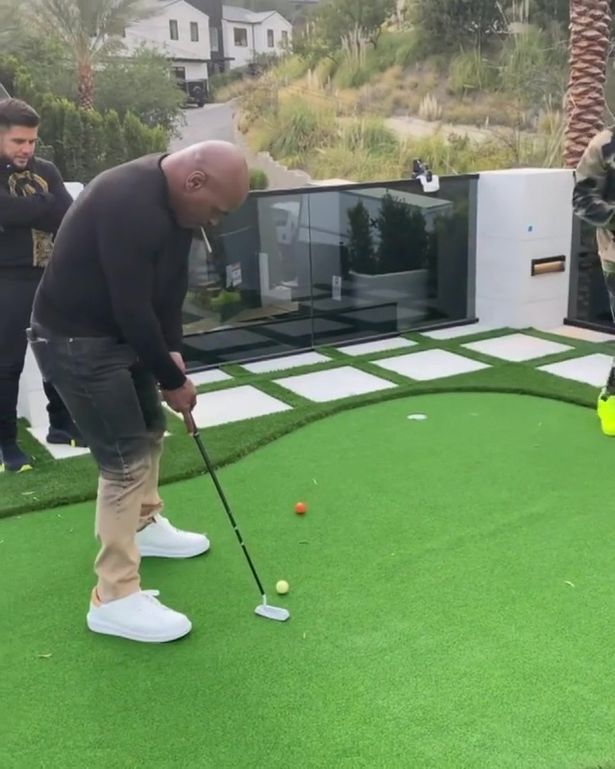 While the boxing hero also took a round on the Terminator actor's mini golf green
