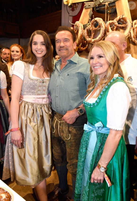 Arnold Schwarzenegger between his daughter Christina and his partner Heather Milligan during the 29th Weisswurstparty at the Stanglwirt Hotel in Going, Austria, on January 27, 2020.