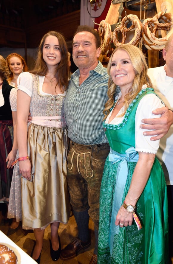 Arnold Schwarzenegger between his daughter Christina and his partner Heather Milligan during the 29th Weisswurstparty at the Stanglwirt Hotel in Going, Austria, on January 27, 2020.