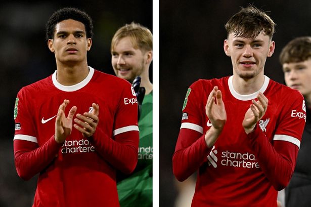 Jarell Quansah and Conor Bradley applaud the travelling Kop after Liverpool reach the Carabao Cup final