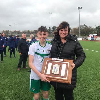 Bradley, here with his mum Linda, won the prestigious Victory Shield with Northern Ireland in 2018