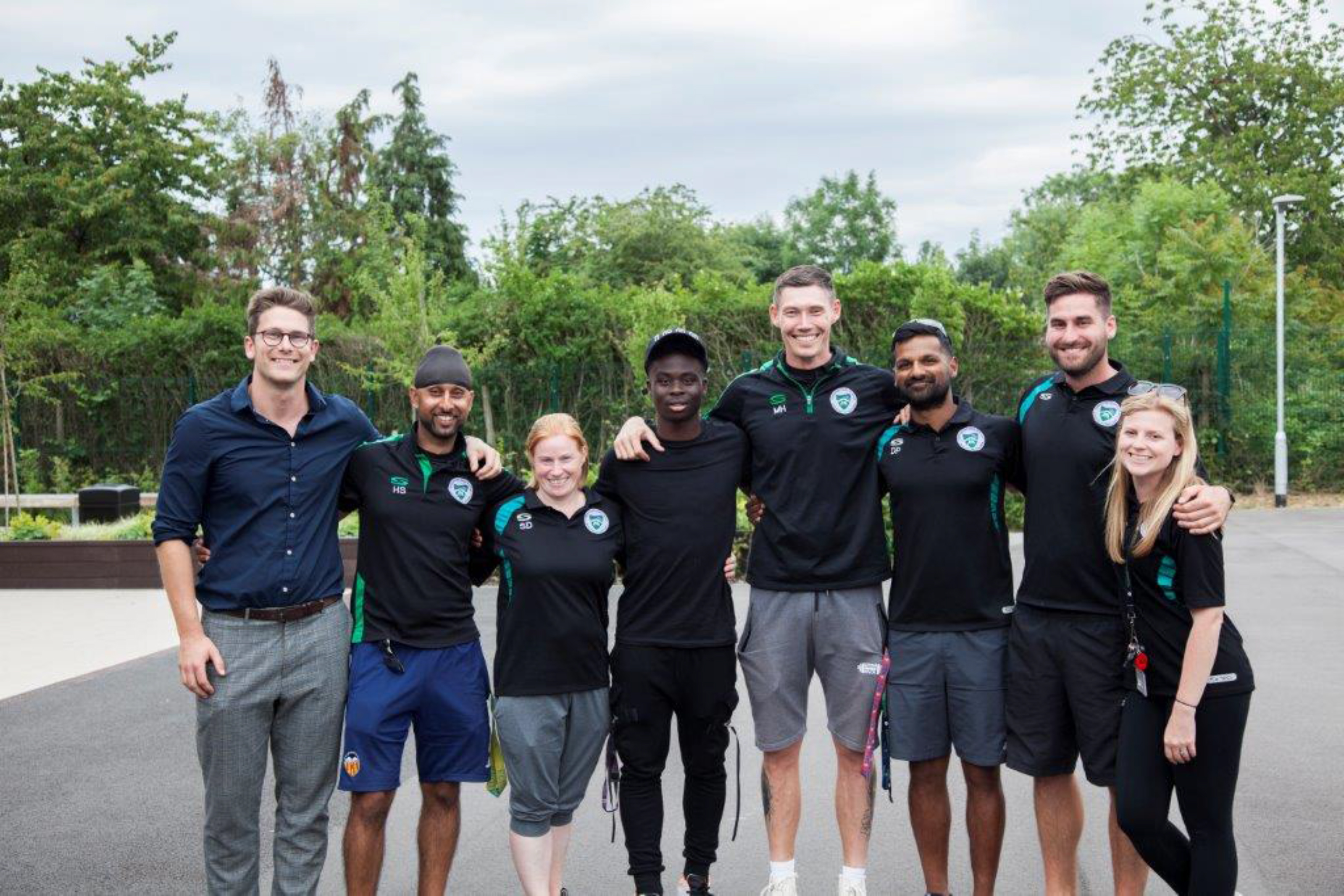 Saka's former teachers, including Mark Harvey (to his right) and Dipesh Patel (next to Harvey) spoke of Saka's modesty