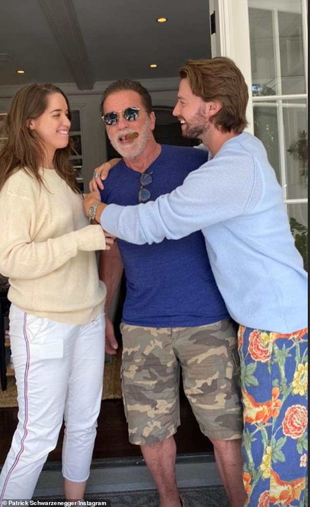 Family fun: Patrick also shared a photo of him and his sister Christina embracing a cigar-smoking Arnie on Sunday