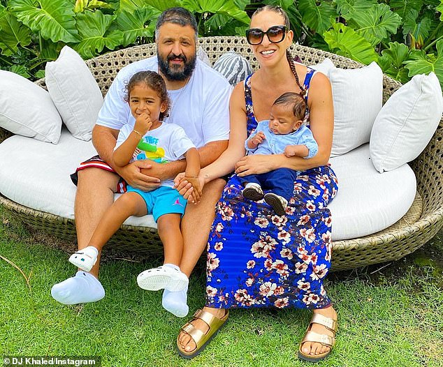 DJ Khaled matches floral patterns with wife Nicole Tuck and their two sons  for cover of Parents | Daily Mail Online