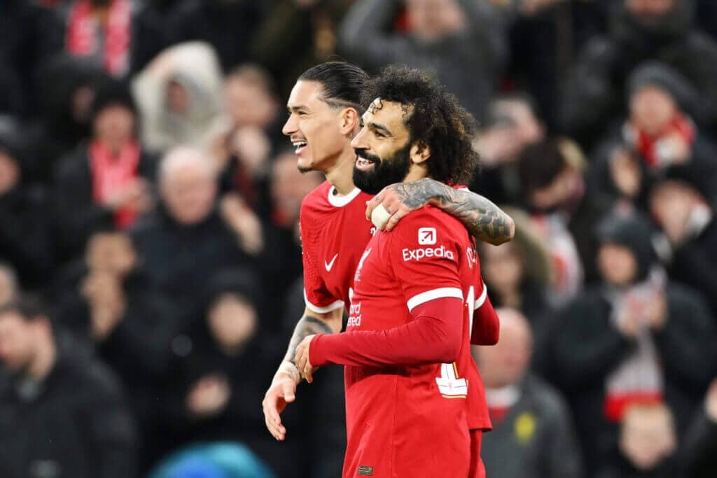 LIVERPOOL, ENGLAND - DECEMBER 20: Mohamed Salah of Liverpool celebrates with teammate Darwin Nunez after scoring their team's fourth goal during the Carabao Cup Quarter Final match between Liverpool and West Ham United at Anfield on December 20, 2023 in Liverpool, England. (Photo by Michael Regan/Getty Images)