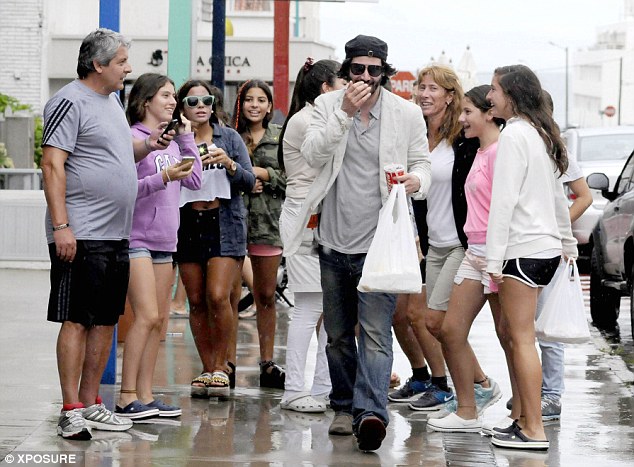 Girls girls girls: The heart-throb actor looked amused at the attention he was getting from his fans