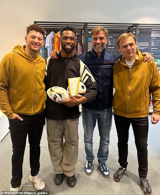 Patrick Mahomes, Siya Kolisi, Jurgen Klopp and Bjorn Gulden pose for a photo at Adidas headquarters