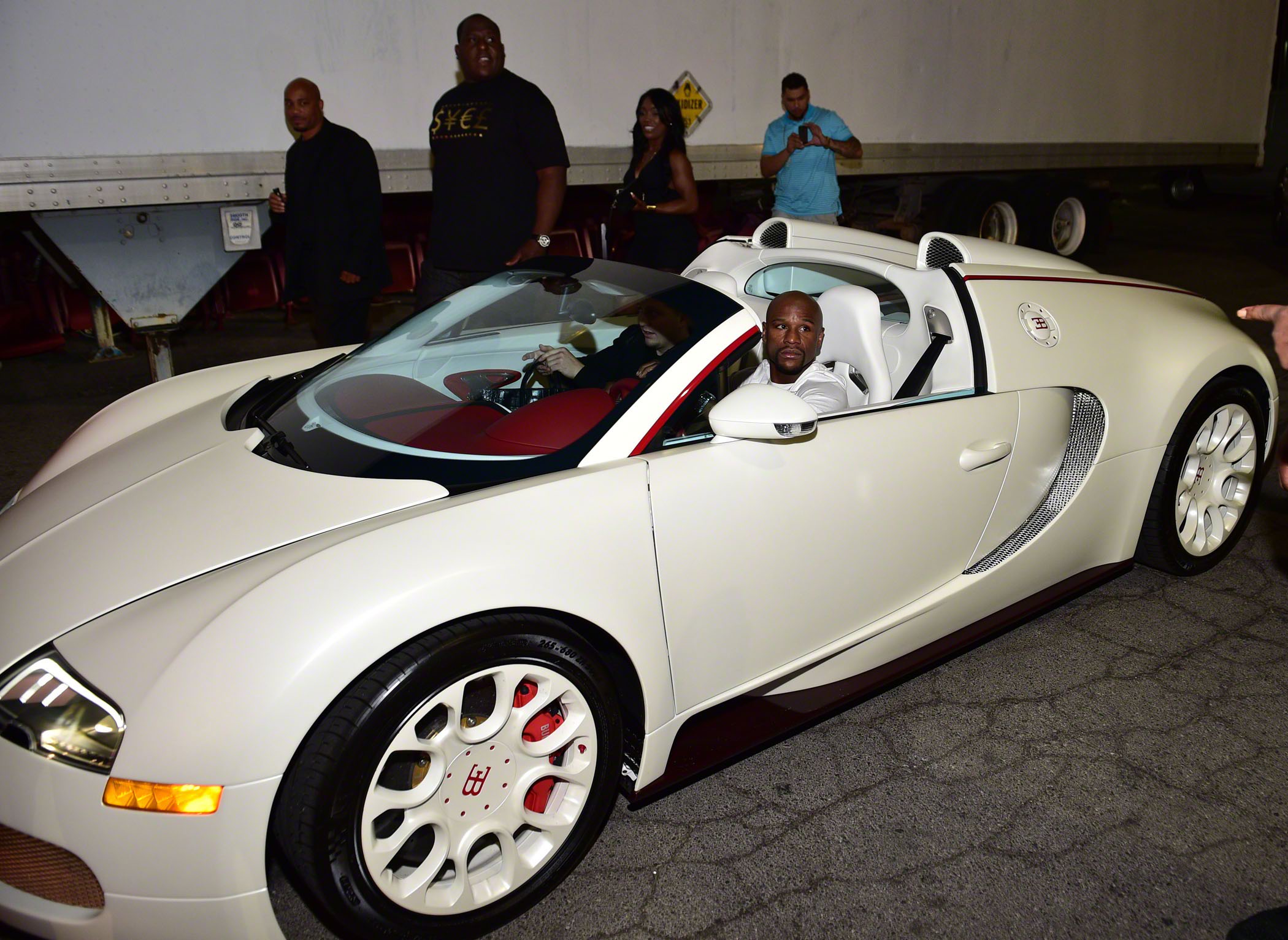 The boxing legend also owns a Bugatti in white