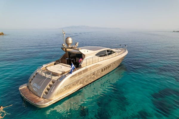 Aerial view of Zeus yacht floating in turquoise water