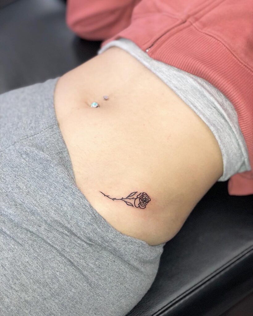 Little Rose Hip Tattoo, a Dainty Bloom Accentuating the Hip Curve: Petite Rose Flourish 