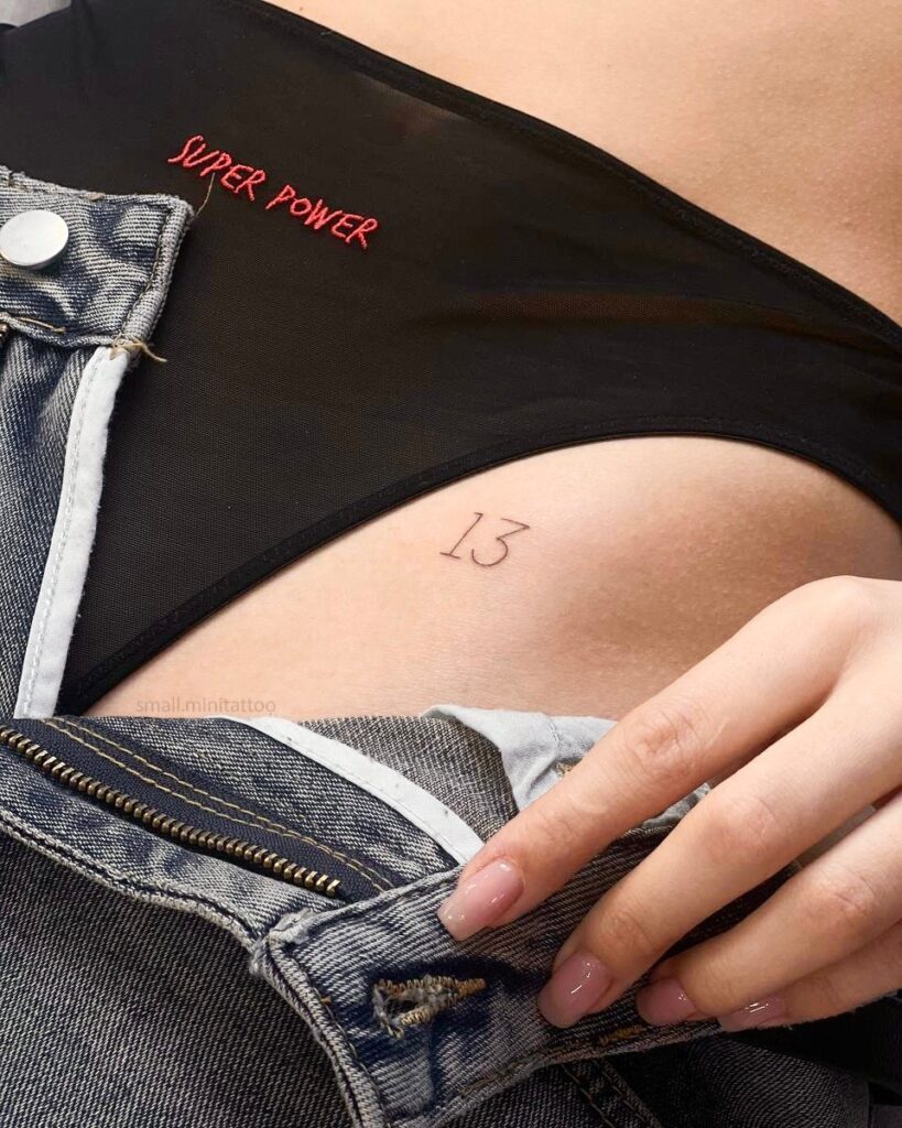 '13' Angel Number Tattoo on the Hip, a Symbol of Transformation and Luck: Numerical Elegance 