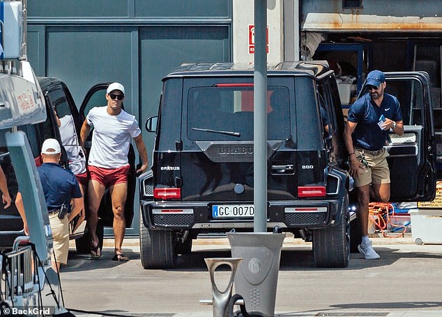 Rolling in: The group were seen arriving in Ronaldo's Mercedes SUV, one of two vehicles he has had shipped for Majorca for his break