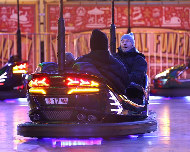 Game on: The couple, who got engaged in 2016, appeared to be joined by some other friends as they all let loose on the dodgems