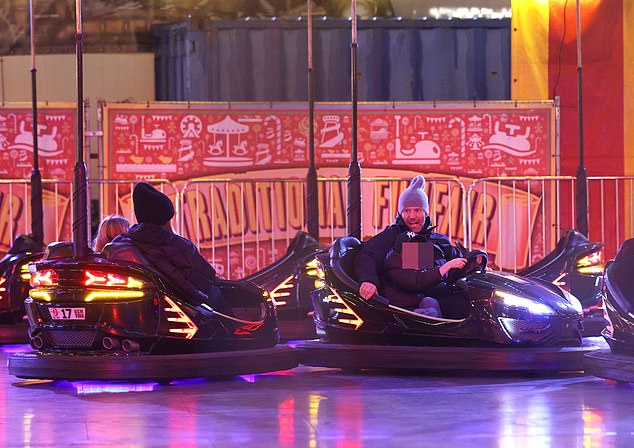 Watch out! The group seemed to be having a blast as their electric cars crashed into each other, leaving the children squealing with delight