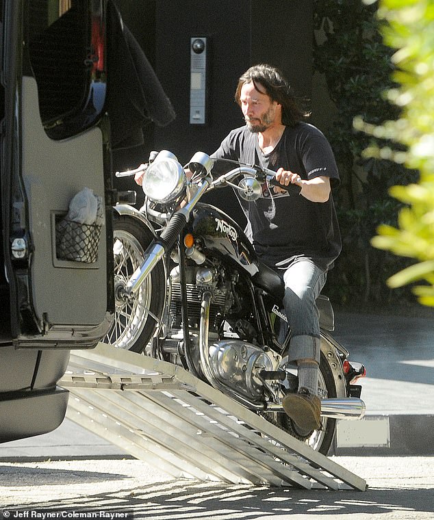 Keanu Reeves was spotted moving his vintage Norton motorbike from his garage onto a truck earlier this month in Los Angeles