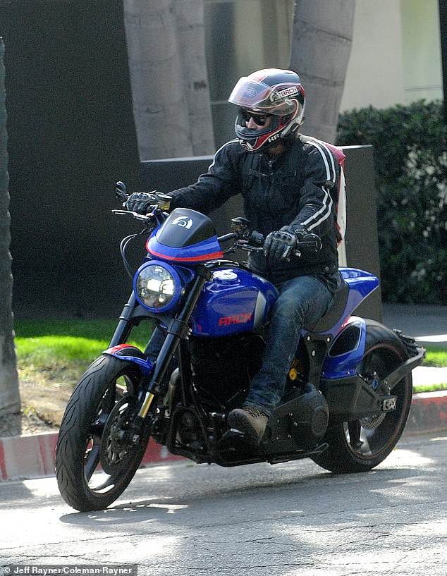 The Hollywood star geared up for a ride in a black leather jacket, riding gloves, and helmet