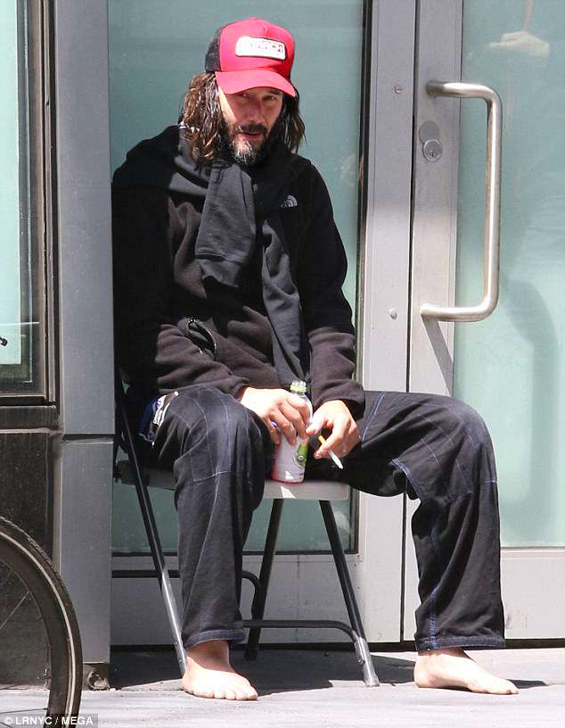 Quite a difference: He¿s one of Hollywood¿s most instantly recognisable stars, but one could be forgiven for overlooking Keanu Reeves as he idled outside a Brooklyn studio on Thursday afternoon