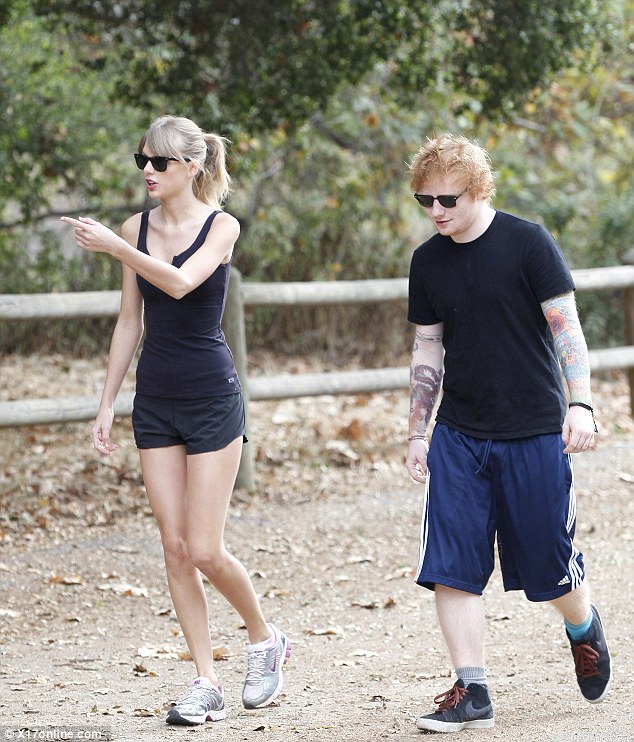 Hiking buddy: Ed Sheeran kept a few steps behind his leader as he followed Taylor up the trail