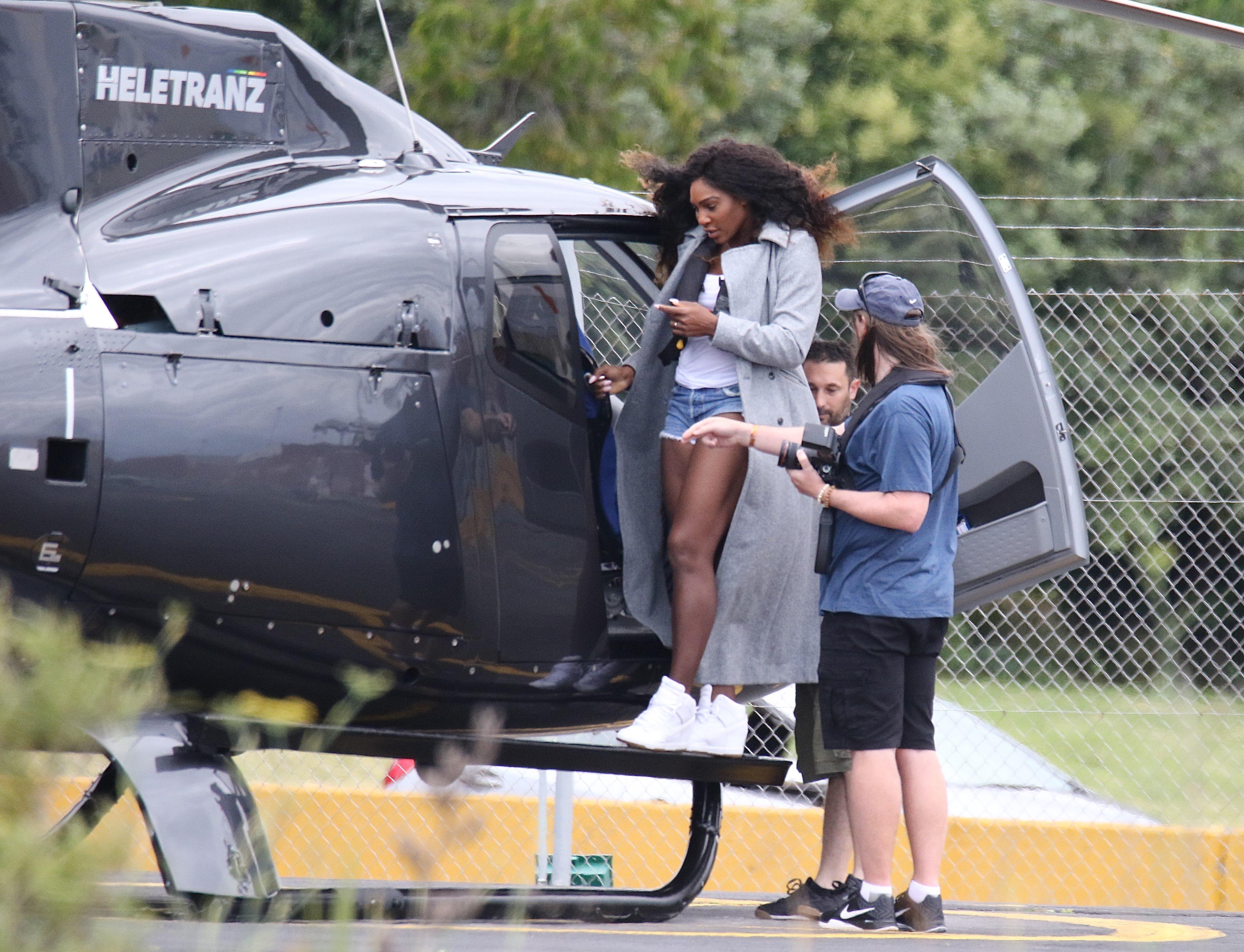 Serena Williams flashes her simple engagement band as she boards a  helicopter with fiance Alexis Ohanian | The Sun