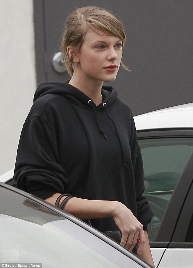 Au naturel: Make-up free Taylor Swift was pictured leaving Body By Simone in West Hollywood on Monday, along with her BFF Selena Gomez