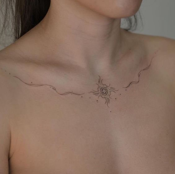 Ornament collarbone tattoo