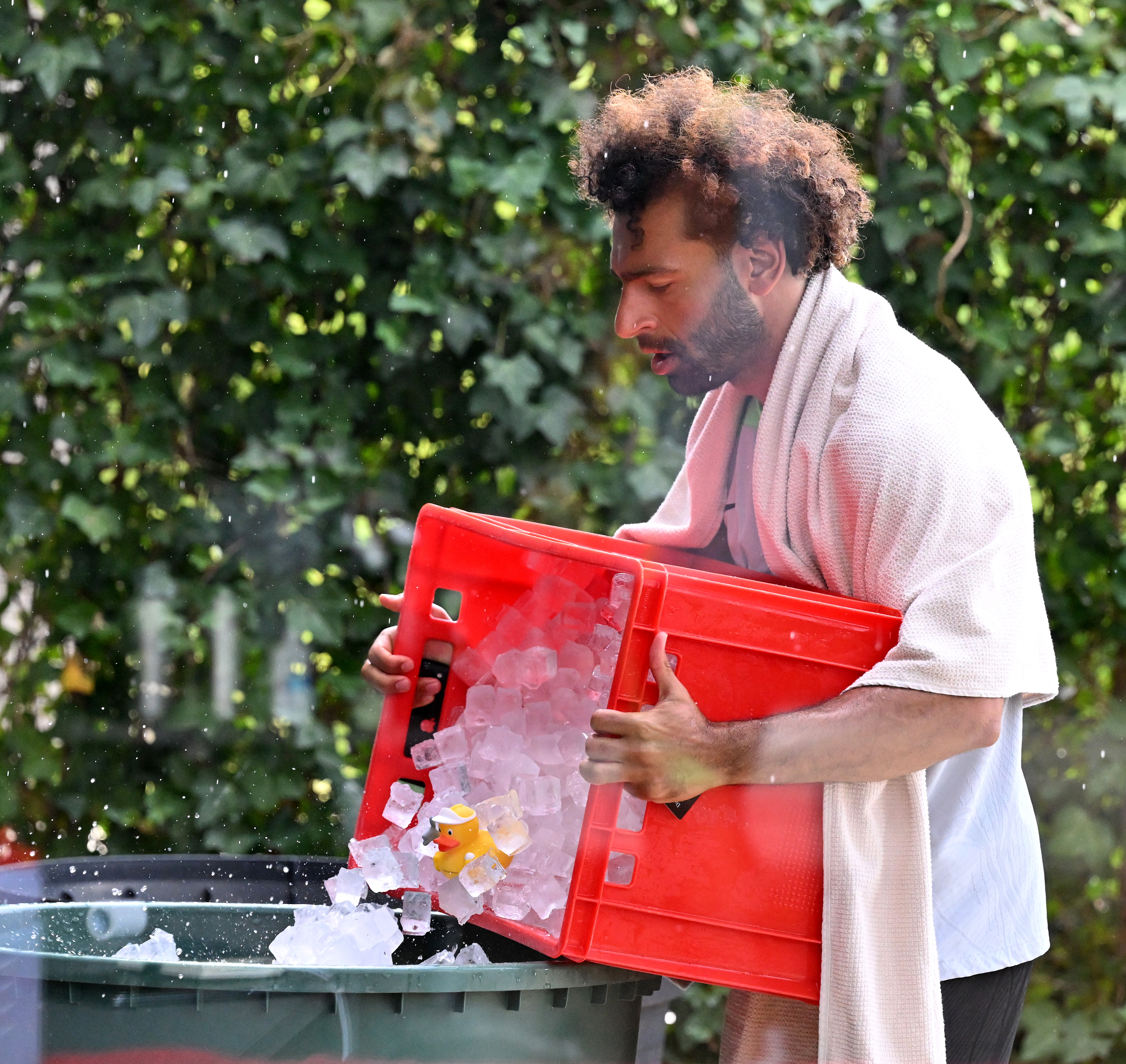 Salah was cooling down after a tough session when some friends appeared