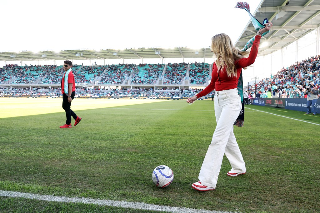 Co-owners Brittany and Patrick Mahomes dribble a soccer ball prior to the match between the Portland Thorns FC and the Kansas City Current at CPKC Stadium