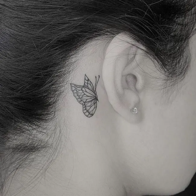 An intricate butterfly tattoo by @tylertelles