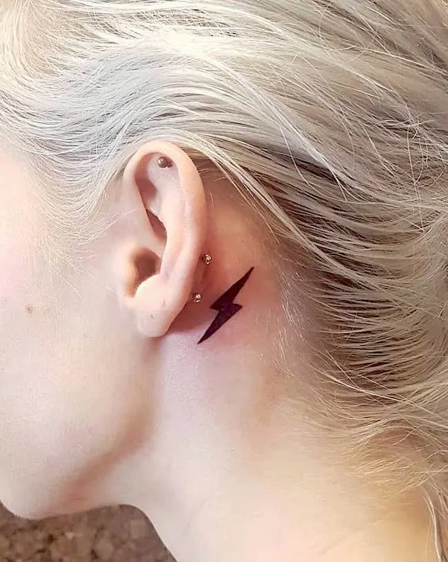 Strike like lightning ear tattoo by @anqiixxwuu