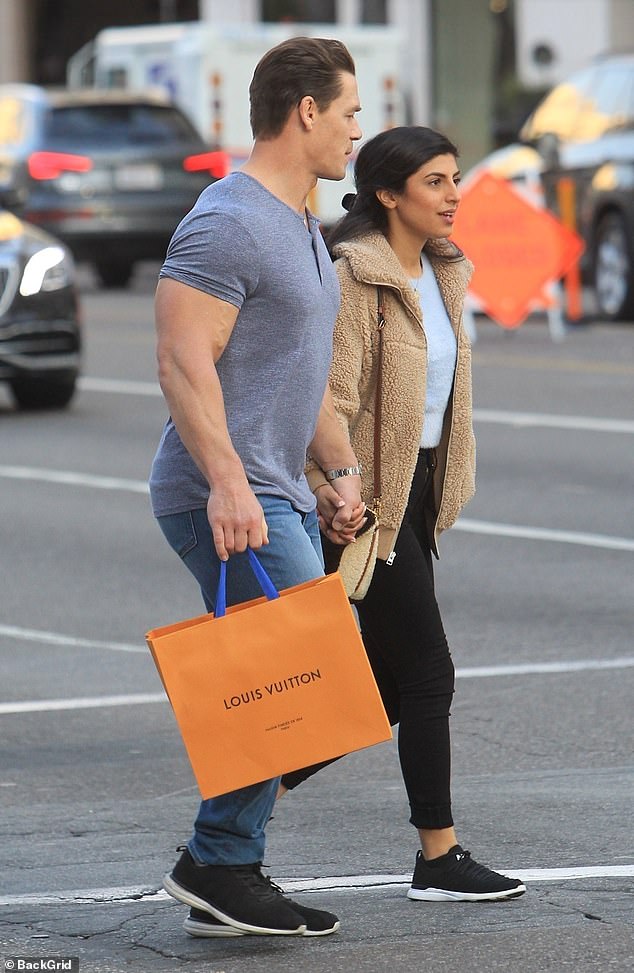 First stop: The couple stopped at Louis Vuitton as they held hands to their next destination