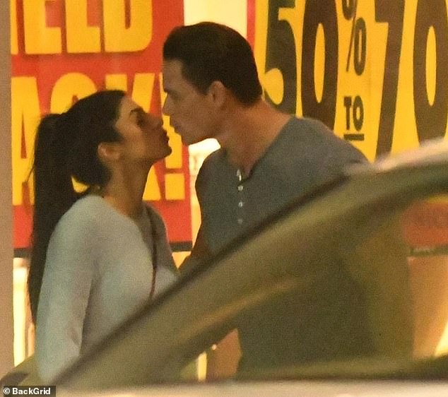 Happy and in love: After their shopping trip, they shared a sweet kiss before going on about their evening