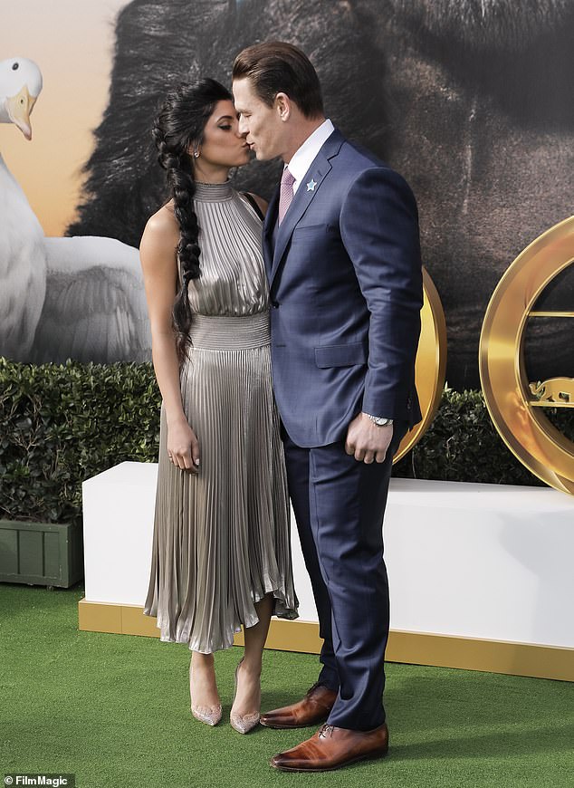 Smooching: The new couple packed on the PDA at the Dolittle premiere at the Regency Village Theatre in Los Angeles on Saturday