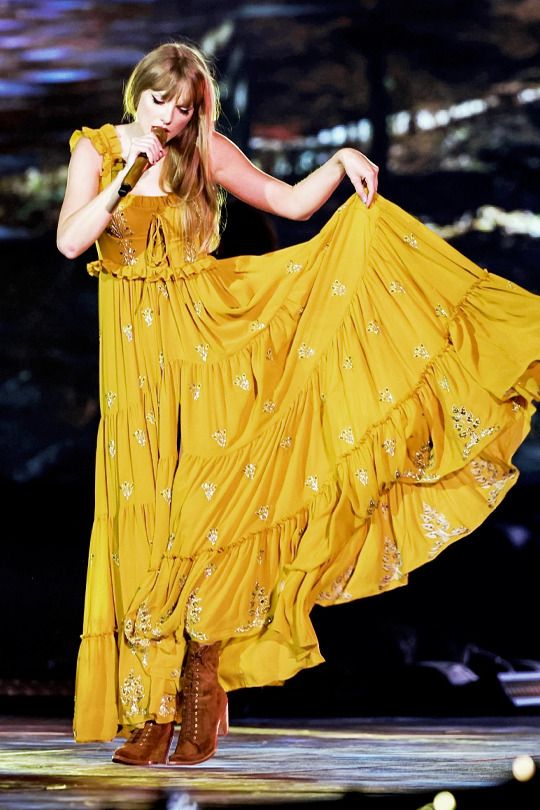 taylor swift eras tour wallpaper, evermore yellow dress, because i dropped  your hand while dancing | Taylor swift dress, Yellow dress, Taylor swift