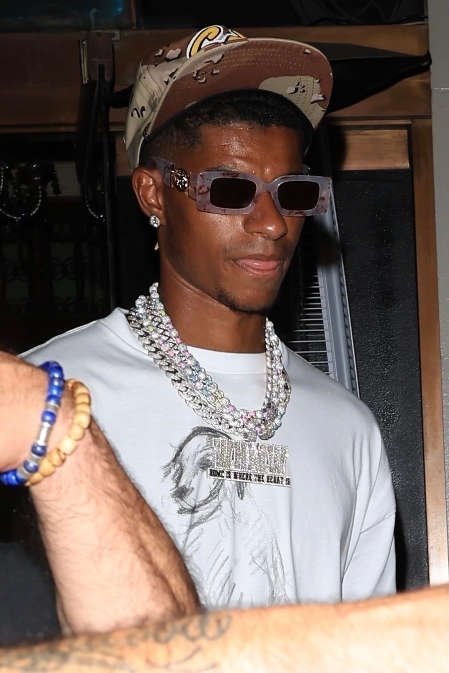 Stylish Marcus Rashford looked a cool customer as he partied at a lingerie pyjama party