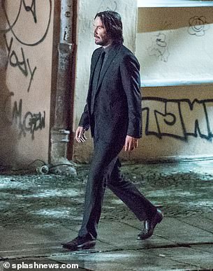 Looking good: Keanu could be seen sporting some stubble which had been carefully shaped