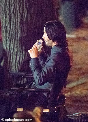 Chilling: The actor was seen taking breaks between scenes and sat on a chair while sipping on some water