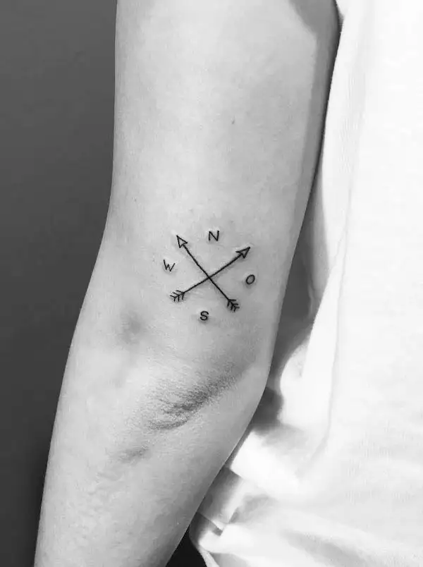 Small simple compass elbow tattoo by @albatattooi