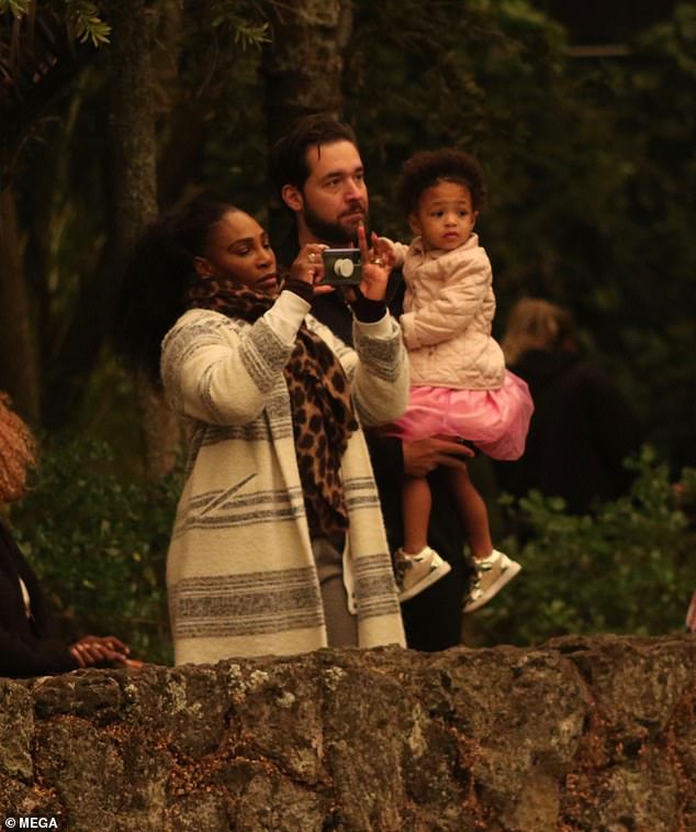 Playing tourist: Serena snapped plenty of pictures as they walked through the park